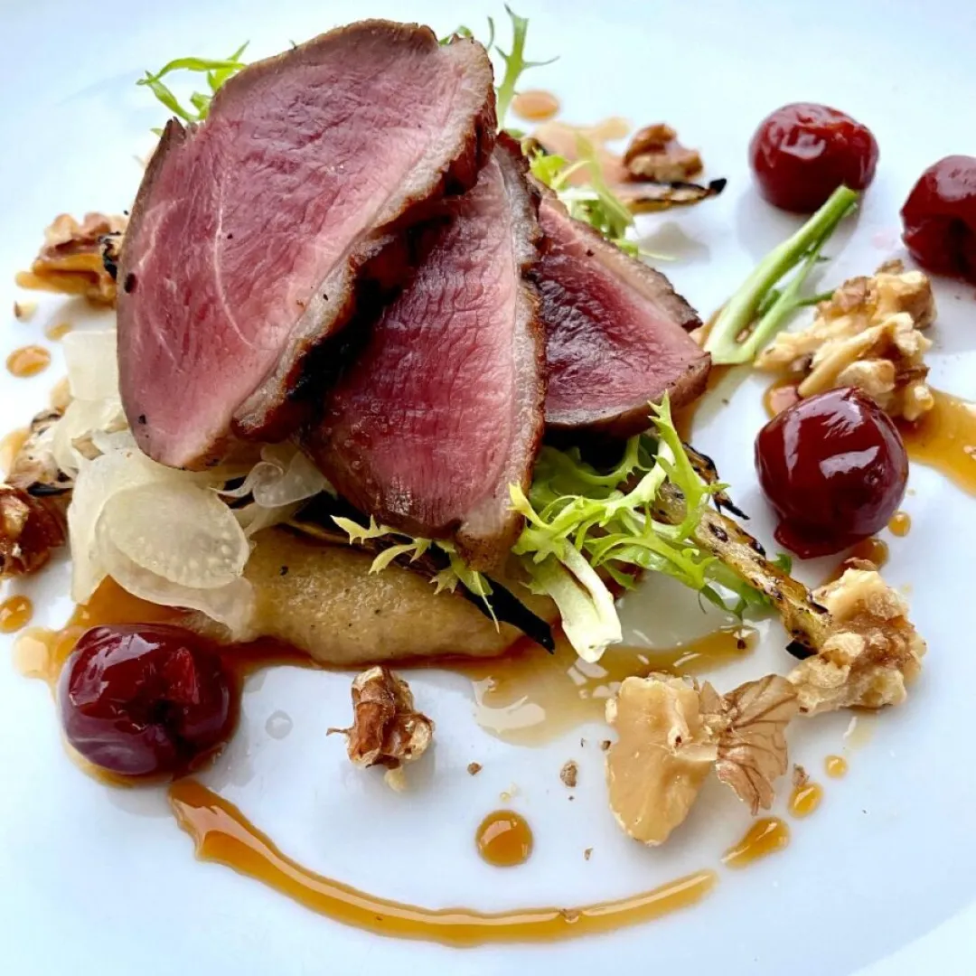 Sanford Restaurant signature dishes Four-Course and Seven-Course Tasting Menus, Seared Sea Scallops with Jamison Farm Lamb Bacon, Chargrilled Elk Loin